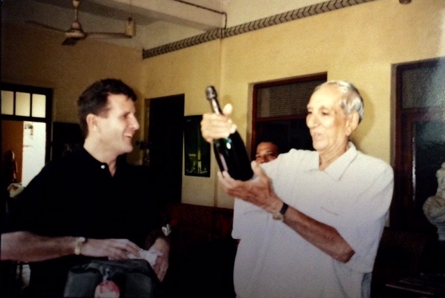 Two people in conversation in an archival photograph