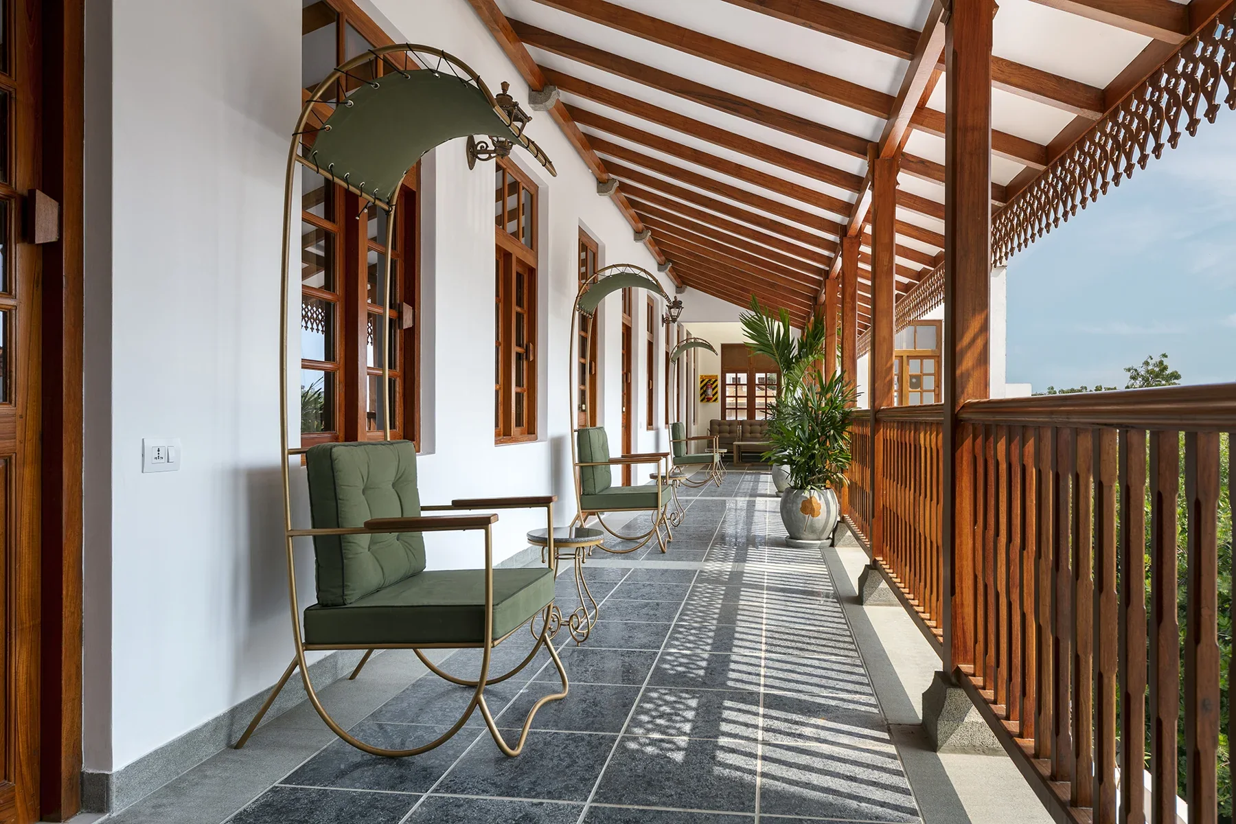 Present-day photograph of a timber-roofed corridor at Grand Hotel D’Europe