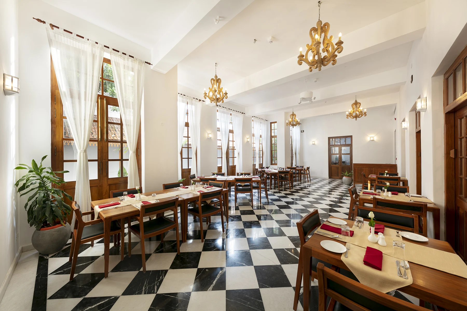 Original MIRA restaurant with chandeliers and checkerboard floor